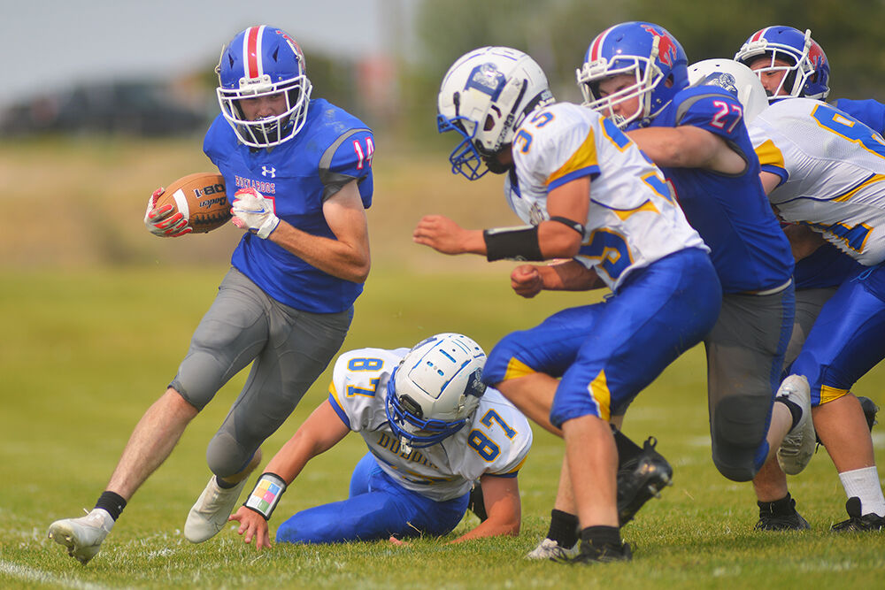 Sam Ramsbottom pushes through one defender